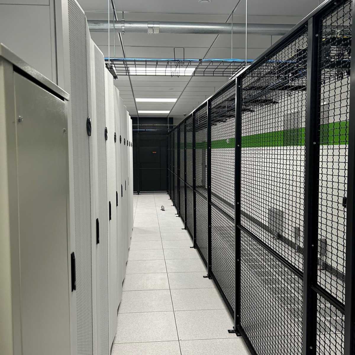 white data center hallway with black mesh access wall