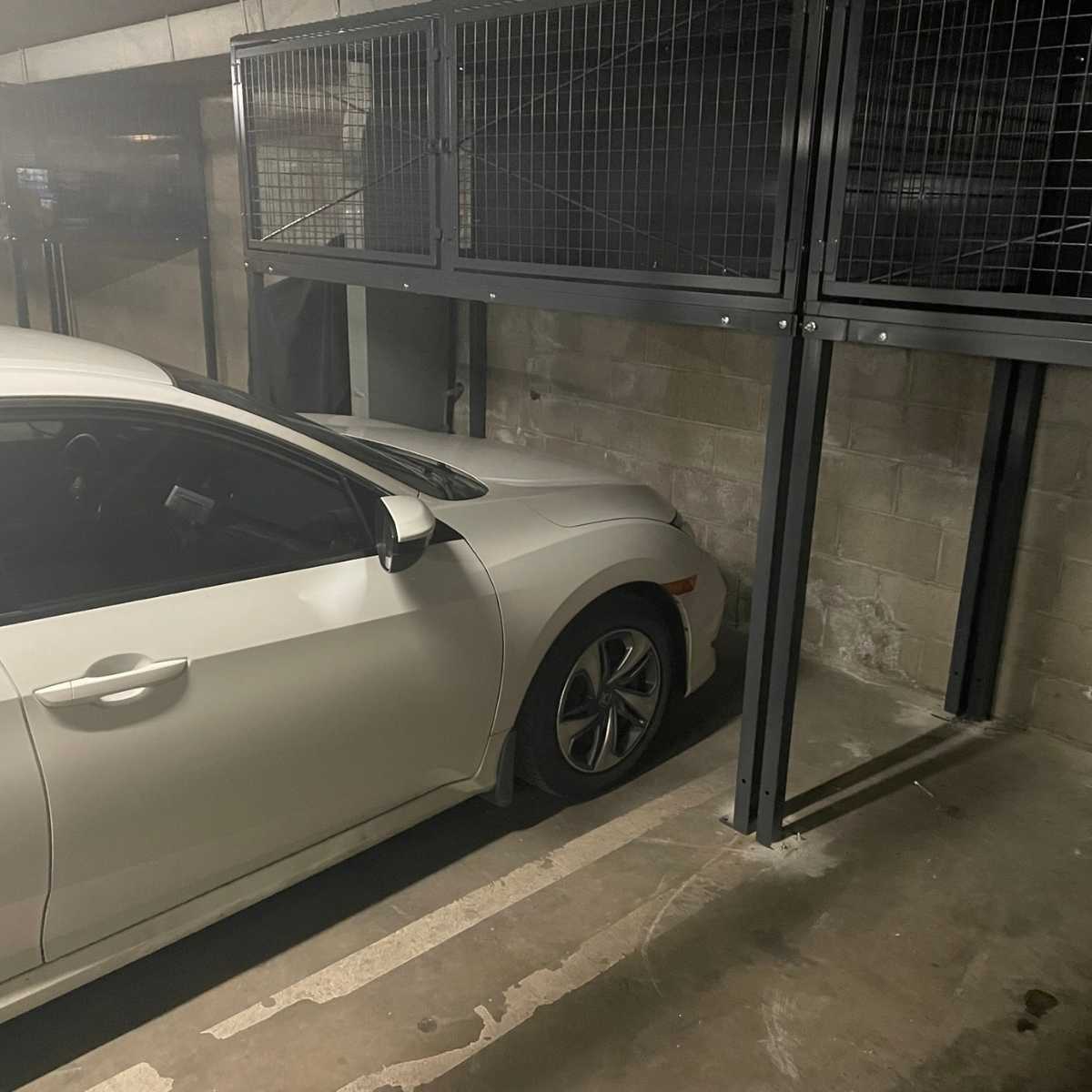 car parked under suspended storage locker