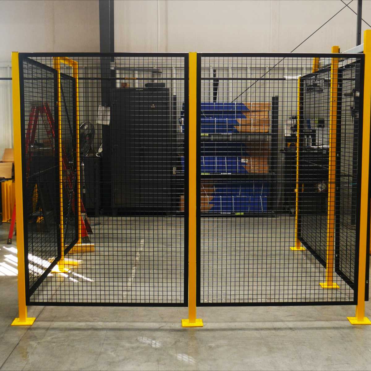 black wire mesh safety cage with yellow posts