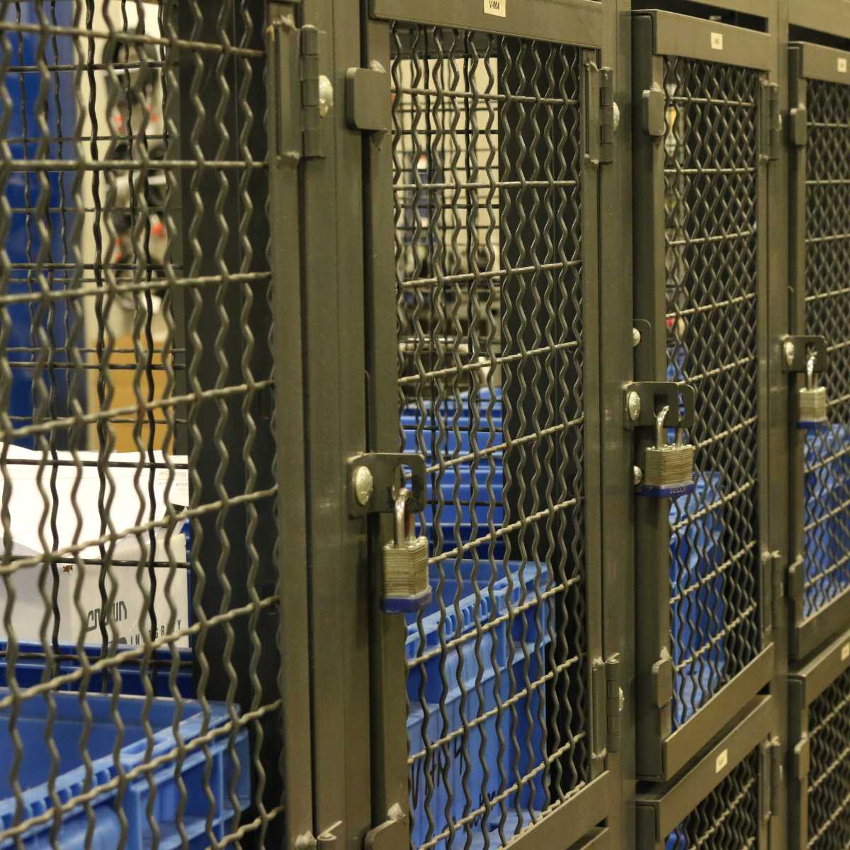 locked wire mesh storage bins
